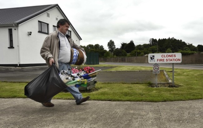 A merchandise seller makes his way to the venue