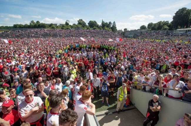 Tyrone supporters on the pitch after the game