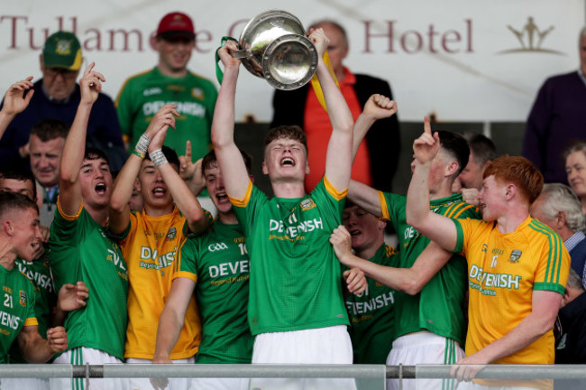 Meath players celebrate with the trophy