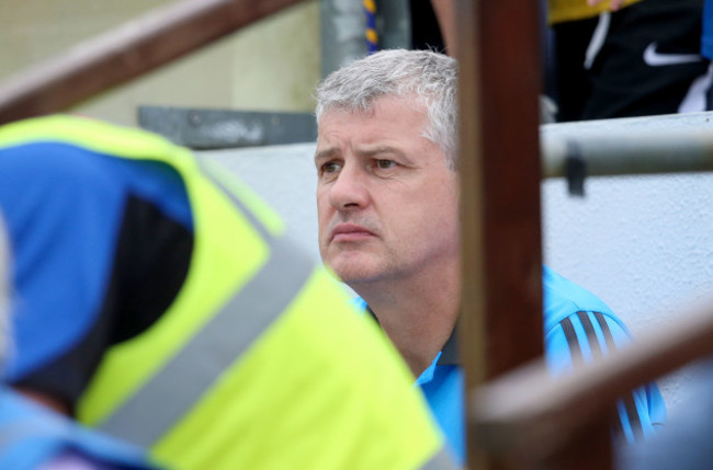 Kevin McStay watching the game away from his dugout