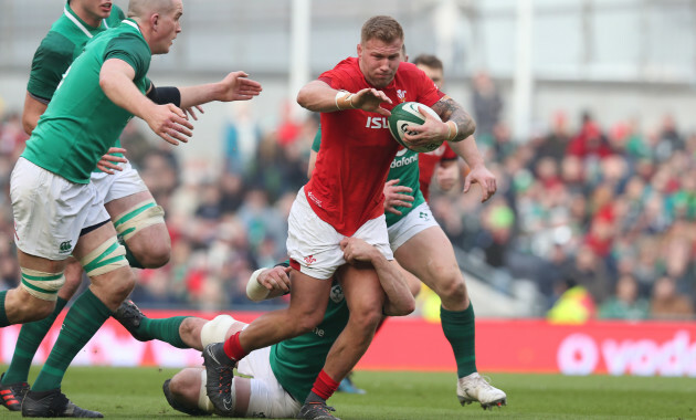 Wales Ross Moriarty is tackled by Ireland’s Devin Toner