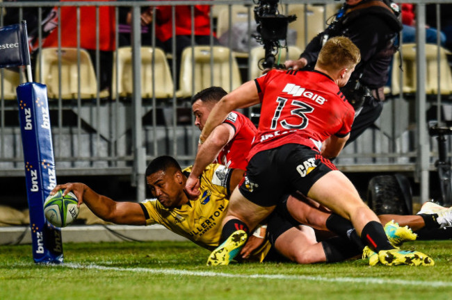 Julian Savea scores a try despite Ryan Crotty and Jack Goodhue