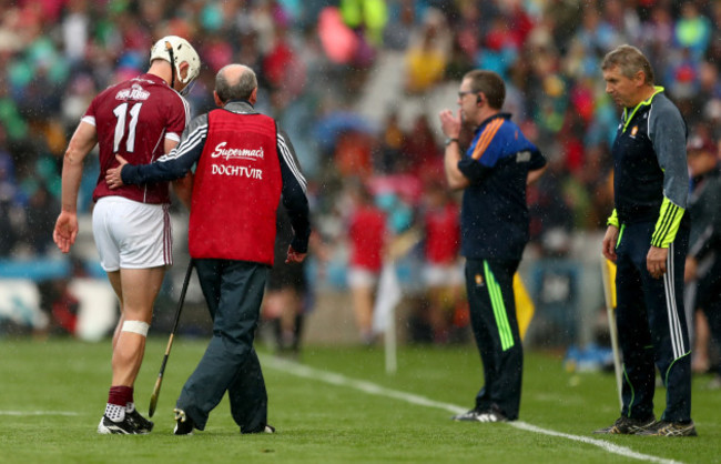 Joe Canning leaves the field the injured