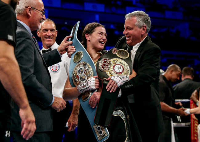 Katie Taylor receives her WBA and IBF belts