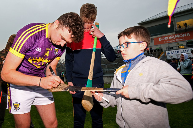 Rory O'Connor signs autographs after the game