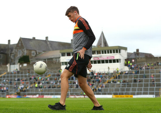 David Clifford warms up before the game