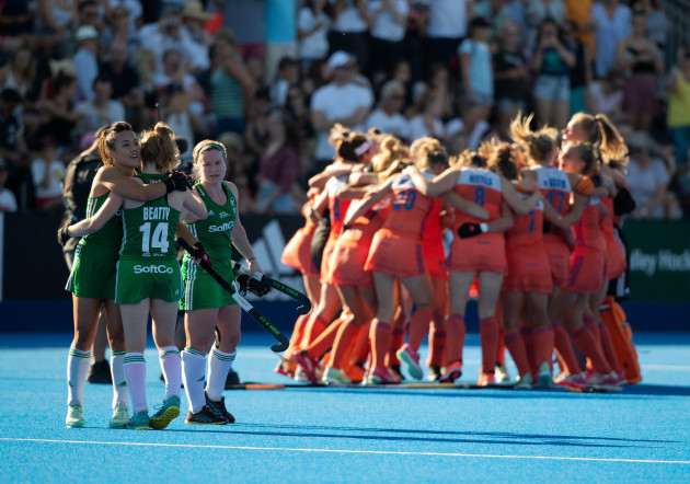 The Irish players embrace as The Netherlands team celebrates