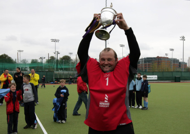 Goalkeeper Nigel Henderson raises the Irish Senior Cup