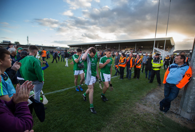 Limerick supporters applaud their players