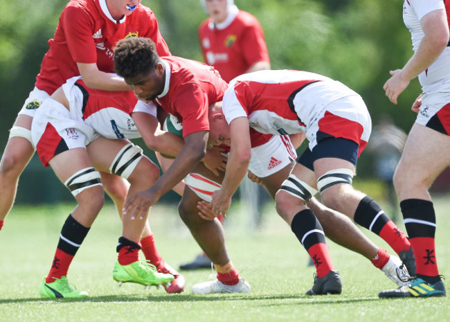 Daniel Okeke is tackled by Reuban Crothers and Riley Westwood