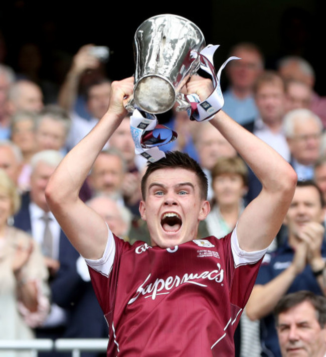 Sean Neary lifts the cup