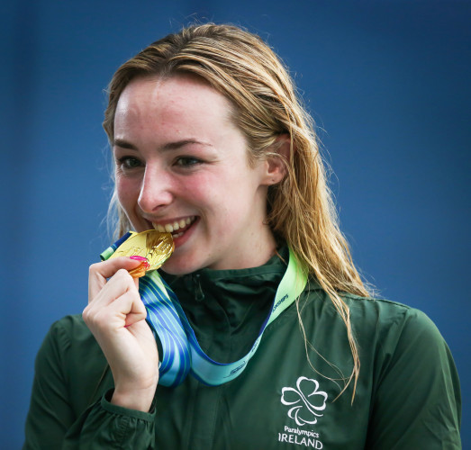 Ellen Keane celebrates receiving a gold medal in the Women's 100m Breaststroke SB8