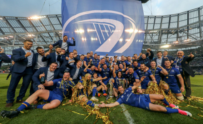 Leinster players celebrate with the PRO14 and Champions Cup trophies