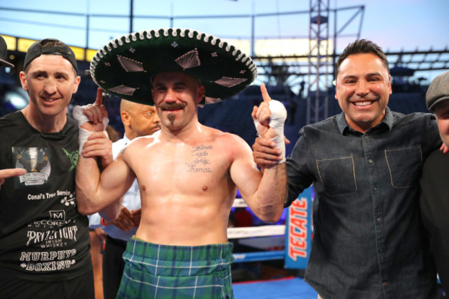 Gary O'Sullivan celebrates with trainer Paschal Collins and Oscar De La Hoya