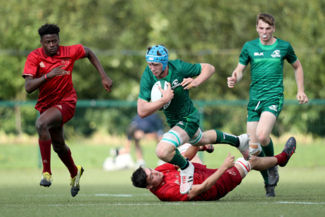 Darragh Murray is tackled by Ferghal O'Donoghue