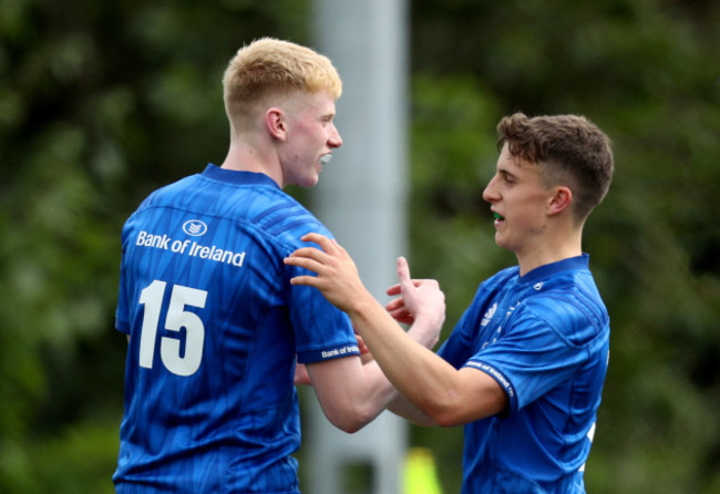 Jamie Osbourne celebrates scoring a try with Tim Corkery