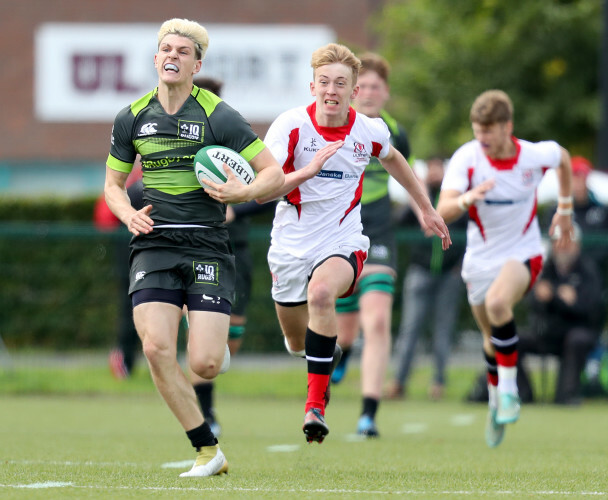 Sean Bundy on his way to scoring a try despite Robin McIlveen