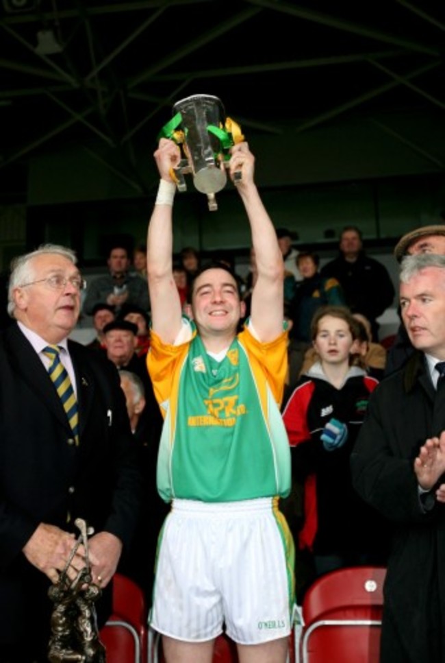 Michael Bevans lifts the cup