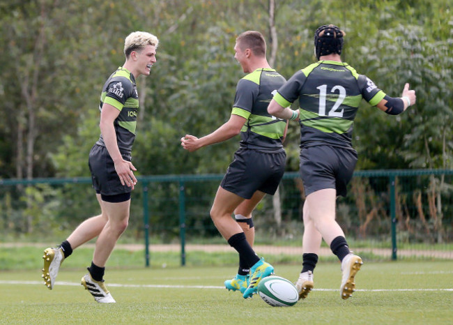 Sean Bundy celebrates scoring a try with Dan Aldwinkle and Hayden Hyde