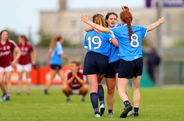 Noelle Healy, Lauren Magee and Sinead Finnegan celebrate at the final whistle