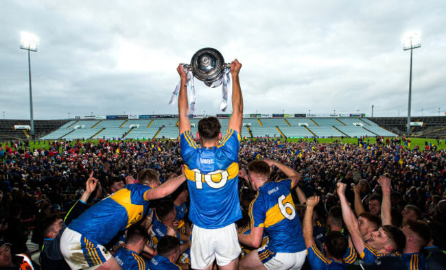 Colin English lifts the trophy