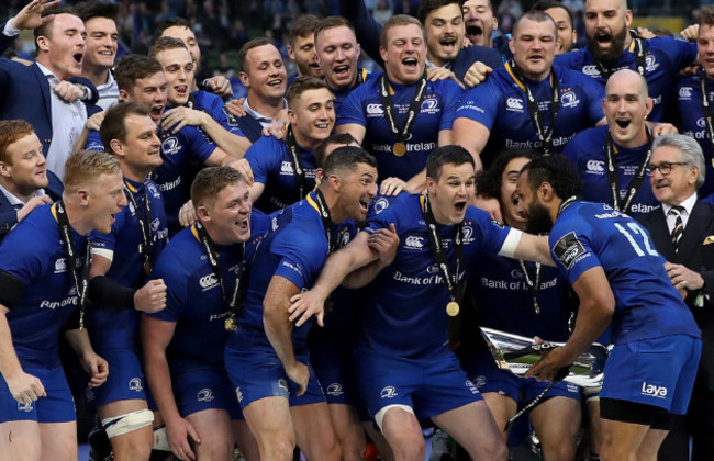 Leinster team celebrate on the podium with the trophy