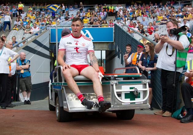 Cathal McCarron leaves the field injured