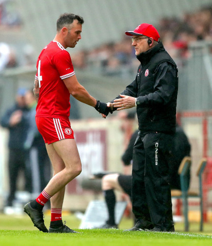 Cathal McCarron with manager Mickey Harte as he is replaced