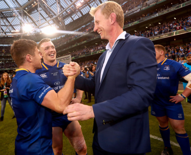 Luke McGrath and Dan Leavy celebrate with head coach Leo Cullen