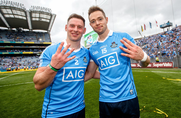 Philip McMahon and Dean Rock celebrate winning their fourth All Ireland in a row