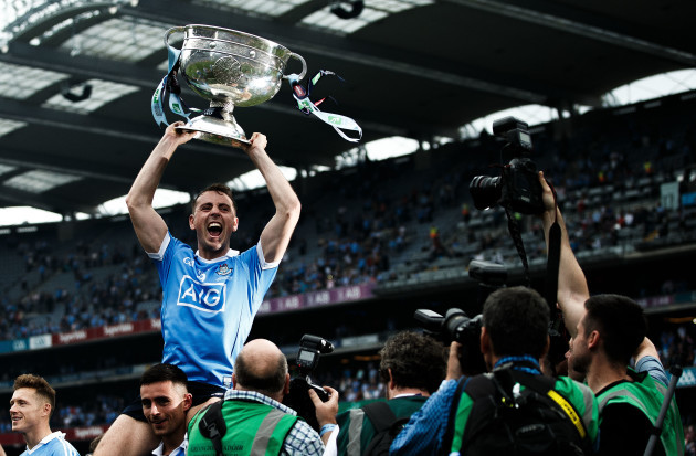 Cormac Costello celebrates after the game with the trophy