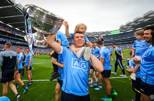 Darren Daly celebrates with his son Odhran Daly and the Sam Maguire