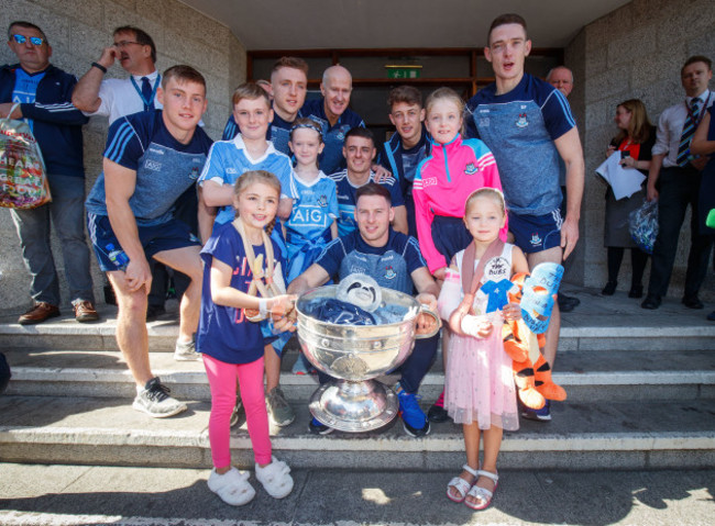 Members of the Dublin team with young fans and the Sam Maguire outside Our Lady's Children's Hospital Crumlin