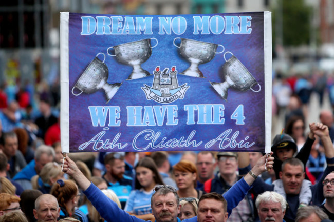 A fan holds up a sign in the crowd