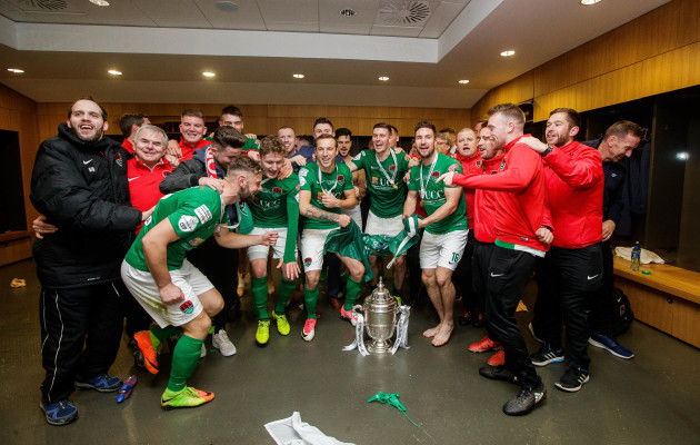 Cork City celebrate with the trophy in the dressing rooms