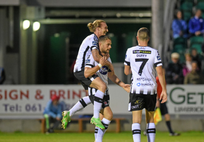 John Mountney celebrates scoring their third goal with Dane Massey