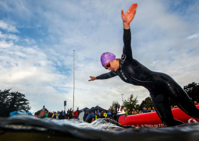 A competitor enters the water during the BMW National Series race at Dublin City Triathlon