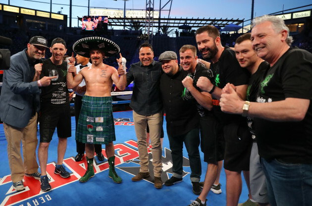 Gary O'Sullivan celebrates with trainer Paschal Collins and Oscar De La Hoya