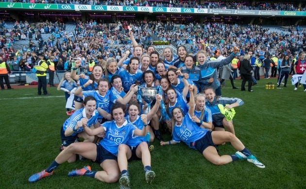 Dublin players celebrates with the Brendan Martin Cup