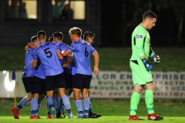 Conor Davis celebrates scoring the equalising goal with teammates