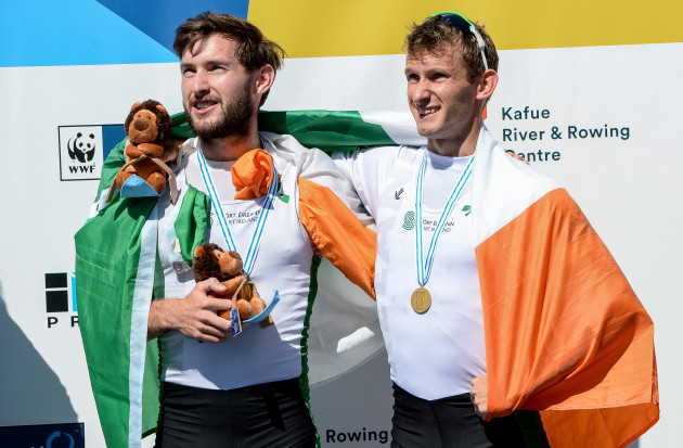 Paul and Gary O'Donovan celebrate with their gold medals