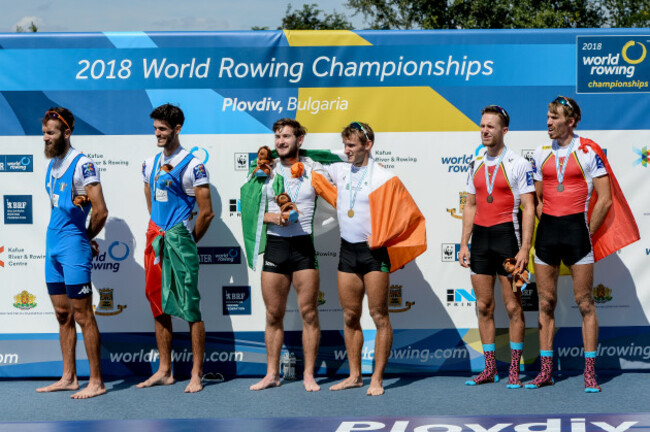 Paul and Gary O'Donovan celebrate with their gold medals