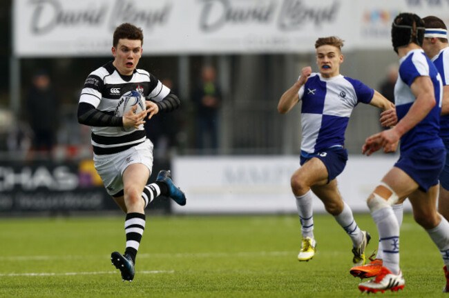 Belvedere College's Hugh O&rsquo;Sullivan charges at the St Andrew&rsquo;s College defence