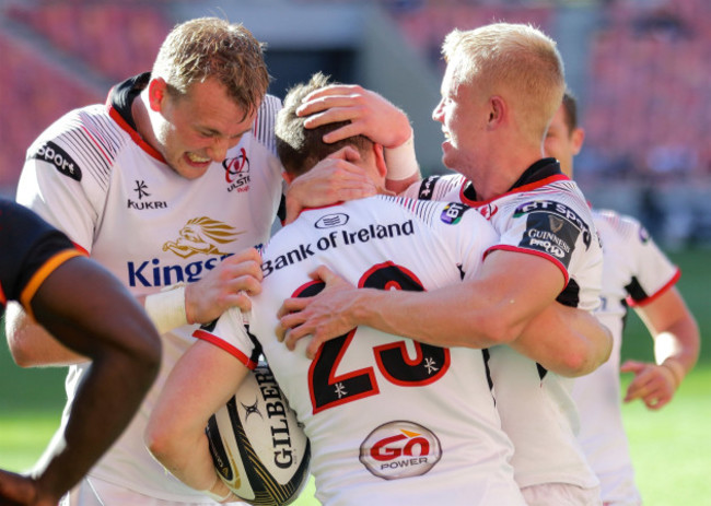 Angus Kernohan celebrates scoring a try with David Shanahan and Kieran Treadwell