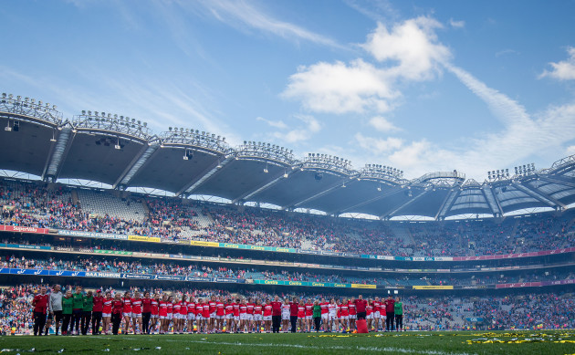 The Cork team stand during the trophy presentation