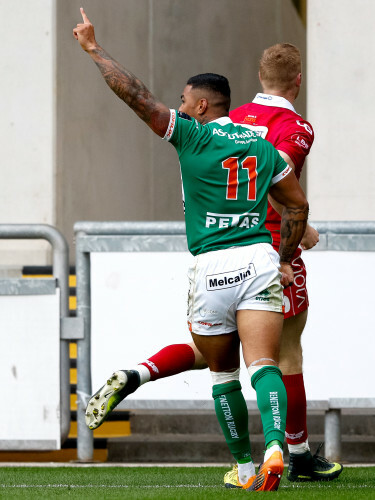 Monty Ioane celebrates scoring his sides third try