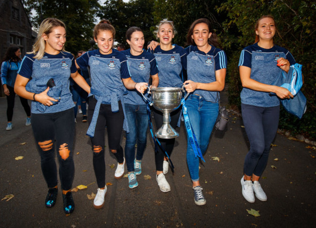 Danielle Lawless, Kate Sullivan, Sinead Aherne, Nicole Owens, Niamh McEvoy and Ciara Lynch bring the trophy into St.Sylvesters' GAA Pitch