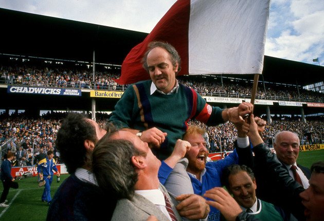 Cyril Farrell is held shoulder high by fans
