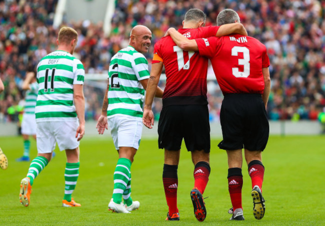 Denis Irwin celebrates scoring their first goal from a penalty with Ryan Giggs