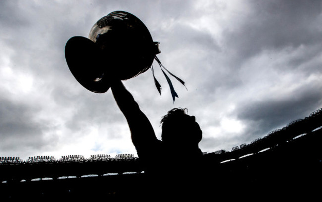 Michael Darragh Macauley celebrates with the Sam Maguire